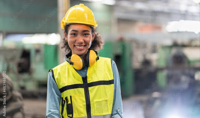 Warehouse worker smiling at camera